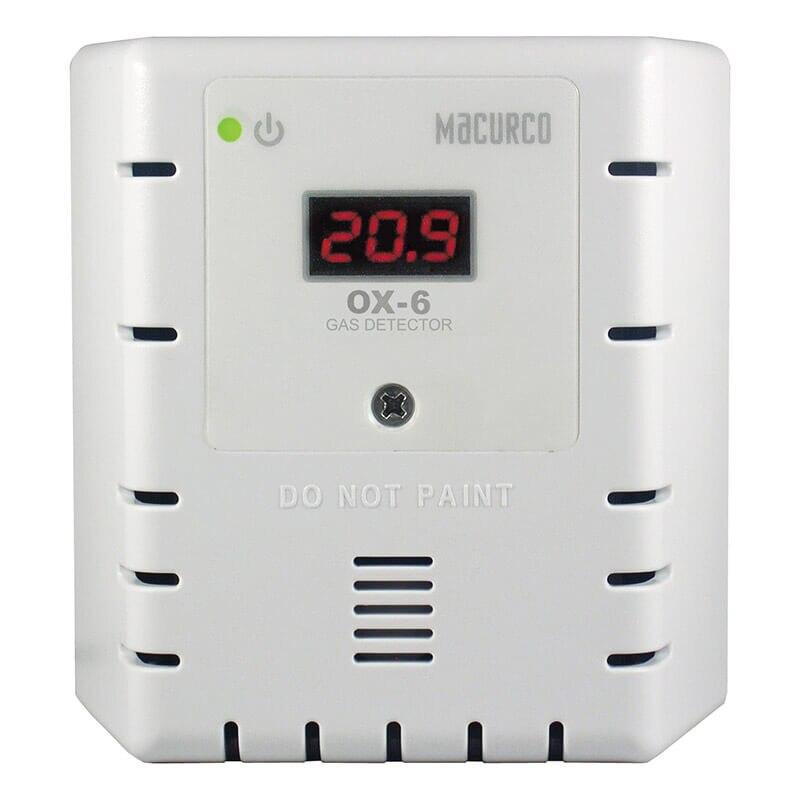 A white Macurco O2 Fixed Gas Detector Controller Transducer with a digital display showing "20.9." This fixed gas detector prominently displays a "DO NOT PAINT" warning and has side ventilation slits for optimal airflow control. A green indicator light is illuminated.