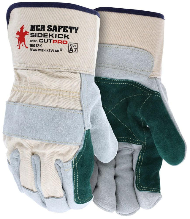 The MCR Safety Sidekick Series Gloves, model 16012K, feature a sturdy design with a side split leather palm and are made from beige and green leather. With reinforced palms and fingers for added protection, these heat-resistant gloves are "Sewn with Kevlar" to offer exceptional durability and cut resistance, ensuring safety during demanding tasks.