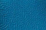 Close-up of a textured blue surface showcasing an intricate pattern of wavy, interconnected lines reminiscent of abstract art or a topographic map. The detailed design calls to mind the reinforced weave found in the MCR Safety Flex Tuff Cut-Resistant Kevlar Glove 9687, renowned for its cut-resistant properties and safety features.