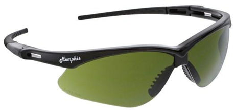 A pair of MCR Memphis Black Welding Safety Glasses MP11_0, featuring black frames with green-tinted polycarbonate lenses. The word "Memphis" is printed in white on the side of the frame. The design includes thin, slightly curved arms with textured grips at the ends, providing both durability and style that comply with ANSI Z87+ standards.