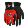 A pair of MCR Safety Ninja gloves with red and black coloring. The text "Ninja BNF" and the brand name "MCR Safety" are printed on them. They feature black nitrile foam palms and fingers, making them ideal for automotive assembly. The back of the gloves is red, complemented by white cuffs edged in black.