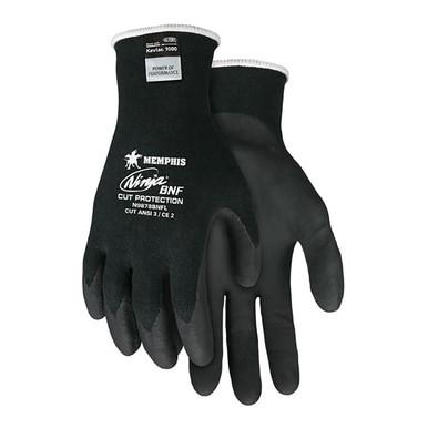 Black protective gloves from MCR Safety, labeled "MCR Memphis Ninja Glove N9878BNF," feature breathable nitrile foam for improved comfort. Designed for safety and durability, these cut-resistant gloves are perfect for tasks that demand cut resistance.