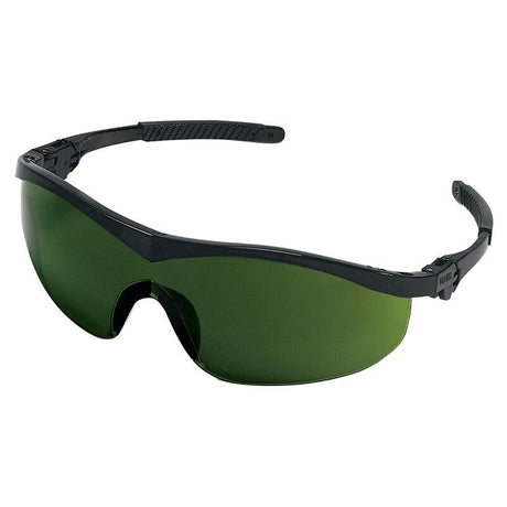 The MCR Safety ST1 Storm Welding Safety Glasses ST11_0 (12 pairs) boast black frames and adjustable earpieces for a perfect fit. With their green-tinted, scratch-resistant lenses and wrap-around style, these glasses provide excellent eye protection during various tasks, making them ideal for welding safety.