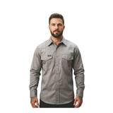 A man with short dark hair and a beard is wearing a gray ForgeFR Forge FR Solid Shirt MFRSLD-002 with two chest pockets, standing against a plain white background.