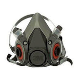 The 3M 6000 Series Half Facepiece Respirator, a NIOSH-approved product from 3M, features a gray mask with red filters and adjustable straps. It is designed to provide effective protection against airborne particles and represents reliable safety in our premium line of dust masks.