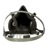 Front view of the 3M 6000 Series Half Facepiece Respirator by 3M, which features black design with adjustable gray elastic straps and a centrally located clear plastic valve. This NIOSH-approved respirator provides optimal protection against airborne particles.