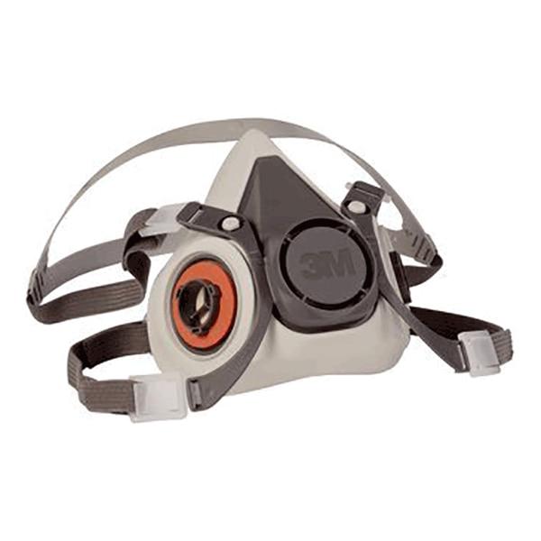 A 3M 6000 Series Half Facepiece Respirator in gray, equipped with an adjustable strap and a circular black filter on the front. This NIOSH-approved mask from 3M features subtle branding and a triangular design, making it suitable for protection against dust and particulates.