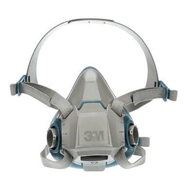 The 3M Half Facepiece Reusable Respirator 6500 Series in gray features reusable cartridges and adjustable straps, prominently displaying the "3M" logo on the front. Designed for enhanced safety, it ensures superior respiratory protection with dual filters on each side.