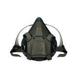 A 3M Half Facepiece Reusable Respirator 6500 Series, in gray and black, equipped with adjustable straps and two side filter slots for optimal fit. This triangularly designed respirator, boasting 3M cartridges, delivers exceptional respiratory protection suitable for industrial or safety applications.