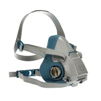 The 3M Half Facepiece Reusable Respirator 6500 Series, in gray and blue, includes adjustable straps and a round filter attachment on the front for dependable respiratory protection. Shown from an angled front view, this mask is compatible with 3M cartridges.