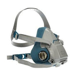 The 3M Half Facepiece Reusable Respirator 6500 Series, in gray and blue, includes adjustable straps and a round filter attachment on the front for dependable respiratory protection. Shown from an angled front view, this mask is compatible with 3M cartridges.