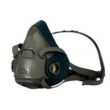 The 3M Half Facepiece Reusable Respirator 6500 Series in gray and black, designed by 3M, provides outstanding respiratory protection with adjustable straps to cover the nose and mouth securely. This mask includes attachment points on the sides for 3M cartridges.