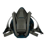 The 3M 6500QL Quick-Release Half Face Respirator Mask by 3M is designed for protective breathing and features a dark gray and black design with adjustable straps, dual filters, and a quick-release feature for easy removal.