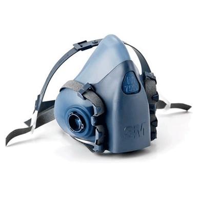 The 3M 7500 Series Half Facepiece Respirator, a NIOSH-approved design by 3M, is displayed against a white background. This blue and gray respirator includes adjustable straps for a medium-size fit and features a cartridge/filter attachment system to guard against hazardous particles.