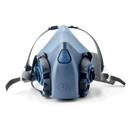 The 3M 7500 Series Half Facepiece Respirator, a blue and gray mask with adjustable straps and dual breathing filters, provides protection against dust, fumes, and other airborne particles. This NIOSH-approved design by 3M ensures reliable safety for various environments.