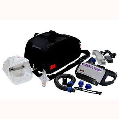 A 3M Versaflo Healthcare PAPR Kit TR-600-HK, featuring a black carrying bag with a white protective hood, breathing tube, charger, battery pack, and connectors, is neatly arranged on a white background. This setup typically complements powered air respirators from 3M for enhanced protection against particulates.