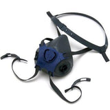 The Moldex 7000 Series Half Mask Respirator, in black and blue, is shown on a white background. This product from Moldex provides excellent breathing protection and features adjustable straps, dual valves, and a head strap for a secure fit.