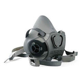 The Moldex 7800 Series Premium Silicone Half Mask, designed by Moldex for respiratory protection, is showcased against a white background. This gray respirator mask features adjustable straps, a valve, durable silicone material, and an ergonomic shape. It meets NIOSH standards for optimal safety and performance.