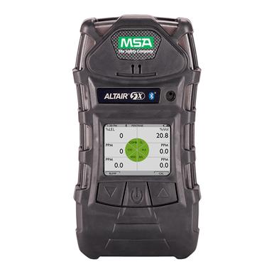 Introducing the MSA Altair 5X Multigas Detector Kit 1011692, a black device showcasing advanced XCell Sensor Technology with a distinctive green logo at the top. Its display provides varied readings, including oxygen levels in ppm, complemented by a circular graphical interface for easy monitoring.