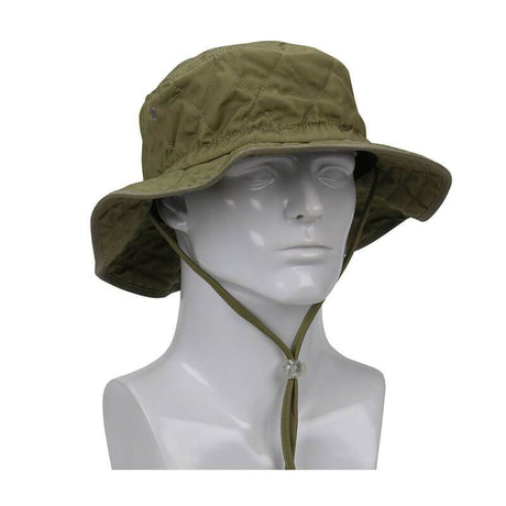 A mannequin models the PIP EZ-Cool Evaporative Cooling Ranger Hat 396-EZ450 from Protective Industrial Products, showcasing its olive green color with a wide brim and adjustable chin strap. The hat features a subtle quilted pattern and small air holes for ventilation, providing cooling relief on hot days with its HyperKewl evaporative cooling technology.