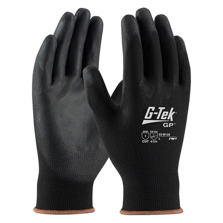 A pair of PIP G-Tek Knit Nylon Blend Glove w/PU Coated Flat Grip 33-B125, shown vertically in black, highlights ANSI and EN cut resistance standards. These gloves by Protective Industrial Products have polyurethane-coated textured fingertips and palms to provide an improved tactile grip, with a light brown seam noticeable at the wrist cuffs.