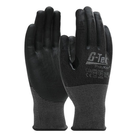 The PIP G-Tek PolyKor Gloves with Nitrile Coated Foam Grip 16-351 offer enhanced grip and touchscreen compatibility. The gloves feature a dark back and cuffs with white speckles, along with markings that indicate certifications, specifications, and notable cut resistance.