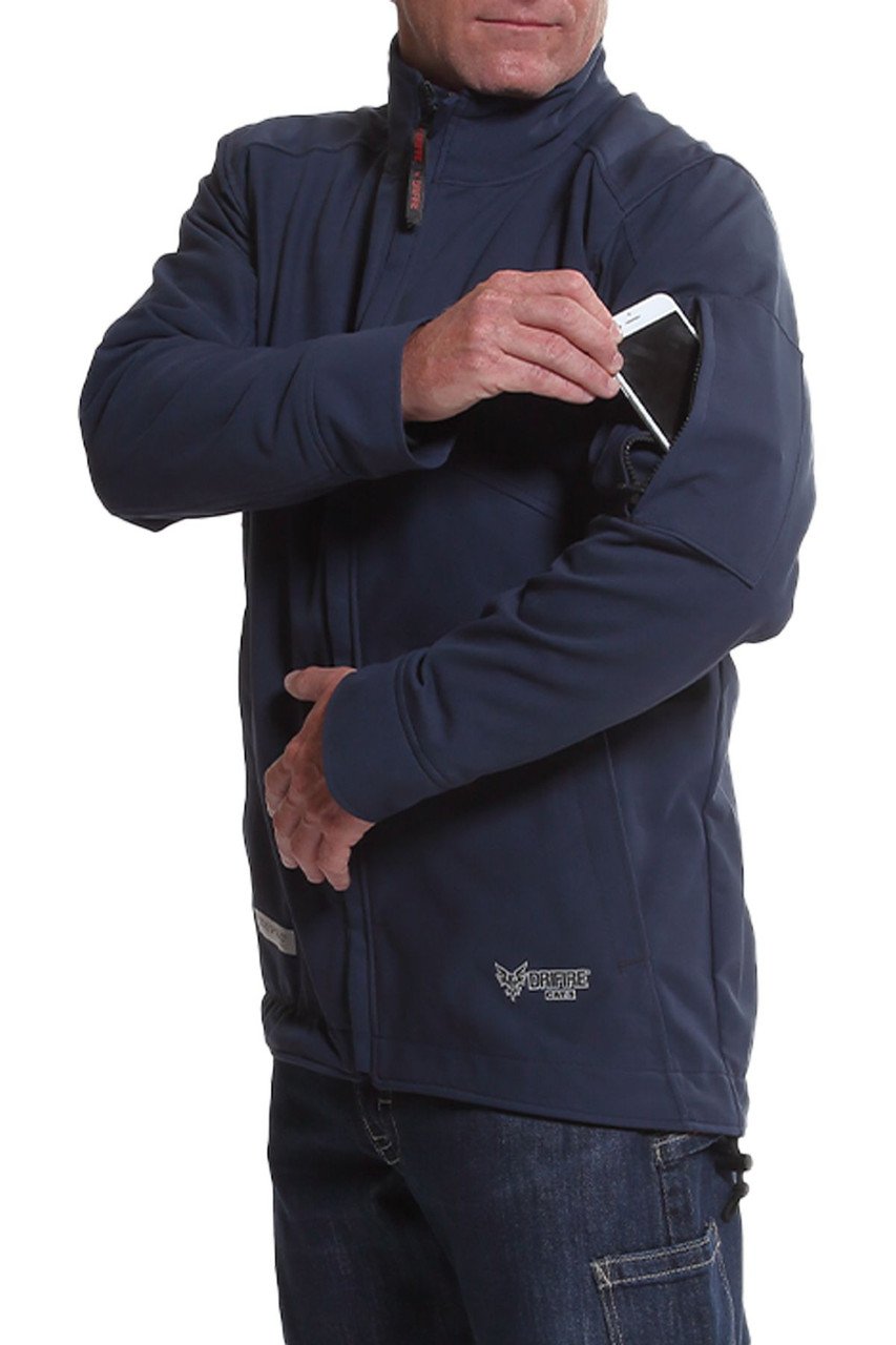 A person in a dark blue NSA DRIFIRE IA FR Windbreaker Jacket DF2-CM-1WWB-NB, crafted from GORE PYRAD fabric, places a smartphone into a zippered sleeve pocket. The jacket sports a small logo near the waist. The individual is wearing dark jeans, with the image concentrating on their upper body.