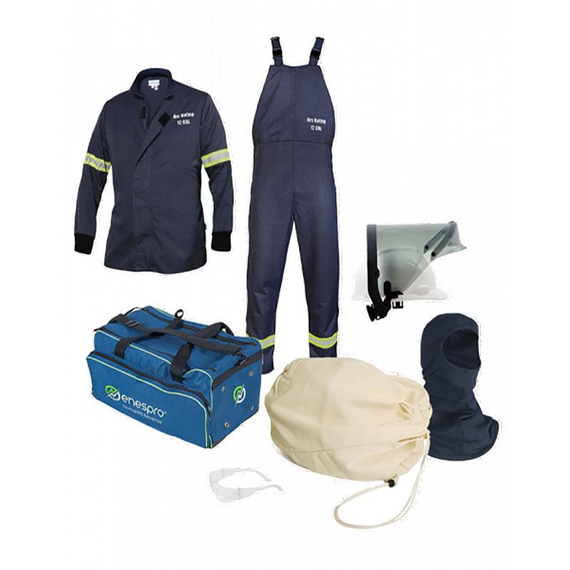 NSA AirLite 12 Cal Jacket & Bib Overall Kit includes protective work garments and accessories such as a dark blue jacket and overalls crafted with Tecgen CC Fabric, complemented by a light blue bag, face shield, hood, safety goggles, and a beige bag. The clothing from NSA features reflective stripes and displays the Arc Rating logo.