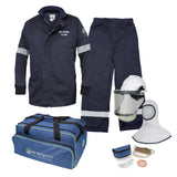 The NSA 12 Cal Enespro Arc Flash Jacket & OverPant Kit (EN12KTWUNB02) features an NFPA 70E-compliant navy jacket and pants with reflective stripes, a white helmet with a face shield and hood, safety glasses, gloves, earplugs, and an insulated blue bag branded "enespro," all crafted from premium Westex UltraSoft material.