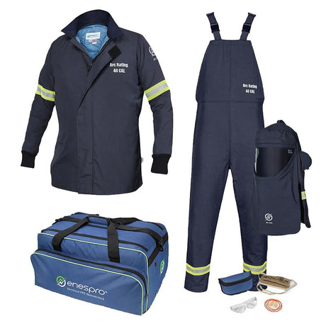 The image showcases the NSA brand's flame-resistant protective workwear, which includes a dark blue jacket, overalls, and a helmet bag with reflective accents. Also featured are gloves, safety glasses, and a blue carrying bag labeled "enespro." This ensemble is ideal for assembling an NSA 40 CAL Enespro AirLite Arc Flash Kit with Dual Fan Hood.