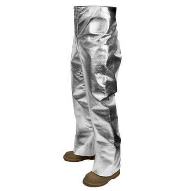 Introducing the NSA CARBON ARMOUR SILVERS H5 Aluminized Pants T45H5_X32, a pair of metallic silver pants featuring wide legs and an elastic waistband. These pants reach just above brown work boots, making them perfect for safety in industrial settings. Crafted from shiny material, they provide heat stress protection with a reflective surface to enhance safety.