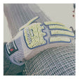 A gloved hand rests on a roll of metal wire mesh. The glove, part of the MCR Predator Hi-Vis Mechanics Gloves with HyperMax (PD6951) from MCR Safety, features gray material with yellow and blue padding and is specifically designed for cut resistance—making it ideal for handling sharp materials. Sunlight washes over the scene, producing a bright, slightly overexposed effect.