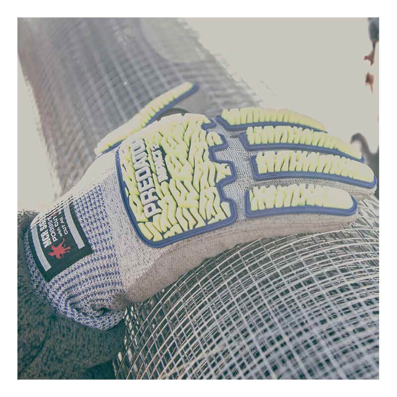 A gloved hand rests on a roll of metal wire mesh. The glove, part of the MCR Predator Hi-Vis Mechanics Gloves with HyperMax (PD6951) from MCR Safety, features gray material with yellow and blue padding and is specifically designed for cut resistance—making it ideal for handling sharp materials. Sunlight washes over the scene, producing a bright, slightly overexposed effect.