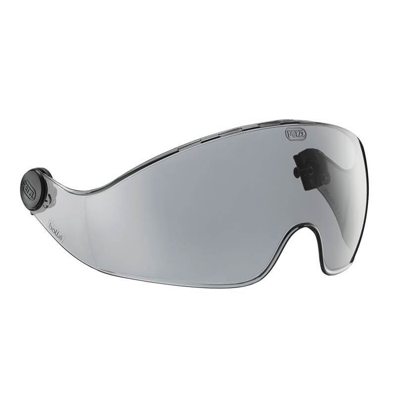 The Petzl VIZIR and VIZIR Shadow Protective Face Shield A15A_ features a transparent, curved visor with a dark-tinted lens and two circular attachment points, specifically designed to integrate seamlessly with the VERTEX helmet. Its refined edges and sleek design provide both style and eye protection.