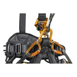 A close-up of a black and orange Petzl ASTRO BOD FAST International Harness C083BA0_ is shown with carabiners attached. This rope access harness by Petzl includes adjustable straps, a CROLL L ventral rope clamp, and padded sections for enhanced comfort and safety.