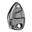 The Petzl GRIGRI + Belay Device D13A by Petzl is a stylishly designed metal belay device. It features engraved safety instructions and comes in a sleek, metallic finish. The device has a dedicated area for rope friction control and includes an anti-panic handle for enhanced security, ideal for climbing activities.