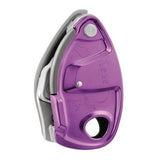 The Petzl GRIGRI + Belay Device D13A, from the brand Petzl, is a purple climbing belay device with a metallic finish. It features a hole at the bottom for rope attachment and boasts an ergonomic design with embossed illustrations and textures. The device includes an assisted braking system and an anti-panic handle for enhanced safety.