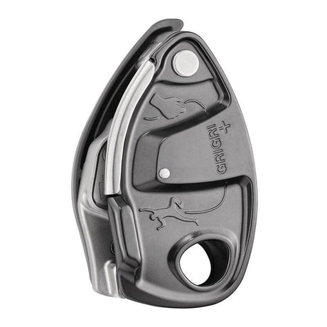 The Petzl GRIGRI + Belay Device D13A from Petzl is a gray, metallic belay device that boasts a sleek design adorned with embossed climbing and animal symbols. It includes a circular opening, offers assisted braking functionality, and features an innovative anti-panic handle for enhanced safety.