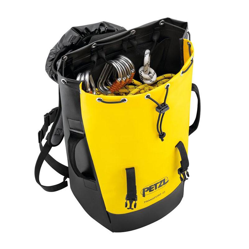 A Petzl TRANSPORT 45 Pack S042BA0_ in yellow and black is open, displaying climbing gear such as ropes and carabiners. This sturdy pack features multiple straps and a drawstring closure, along with thermoformed foam for enhanced comfort.