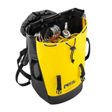 A Petzl TRANSPORT 45 Pack S042BA0_ in yellow and black is open, displaying climbing gear such as ropes and carabiners. This sturdy pack features multiple straps and a drawstring closure, along with thermoformed foam for enhanced comfort.