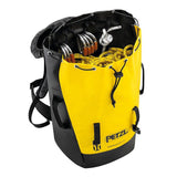 The Petzl TRANSPORT 60 Pack S042CA0_ is a yellow and black backpack featuring shoulder straps, partially open to reveal climbing gear like carabiners and rope. Made from high-strength TPU, its design is tailored for outdoor or climbing use, ensuring your gear remains secure on every adventure.