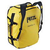 The Petzl DUFFEL Bag S045AA0_, produced by Petzl, showcases a vibrant yellow design with black straps and detailing. It features a large opening for easy access and stands upright to emphasize its side pocket and adjustable shoulder straps, ensuring a comfortable backpack experience.