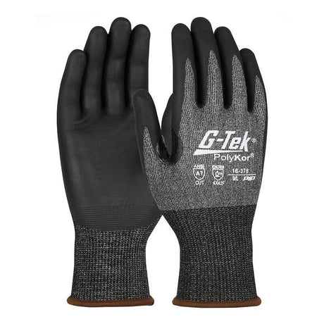 Introducing the PIP G-Tek PolyKor X7 gloves, featuring a nitrile-coated foam grip on black palms and fingers with a gray knitted fabric on the back. These cut-resistant safety gloves offer touchscreen compatibility and have safety ratings printed on the back, emphasizing their protective qualities. Sold in packs of 12 pairs by Protective Industrial Products.