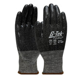 A pair of PIP G-Tek PolyKor Gloves—Silicone Coated Grip 16-473, with a blend of black and gray speckles—is prominently marked to indicate superior cut resistance. Featuring palms that face forward, these gloves highlight their durability and silicone-coated grip for improved handling.