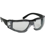 The PIP Bouton Zenon Z11SM Foam Safety Glasses, available in a box of 12 from Protective Industrial Products, feature black frames with a wraparound design and transparent lenses with an anti-scratch coating. These ANSI Z87.1+ certified glasses are perfect for protecting your eyes in diverse work or hobby settings.