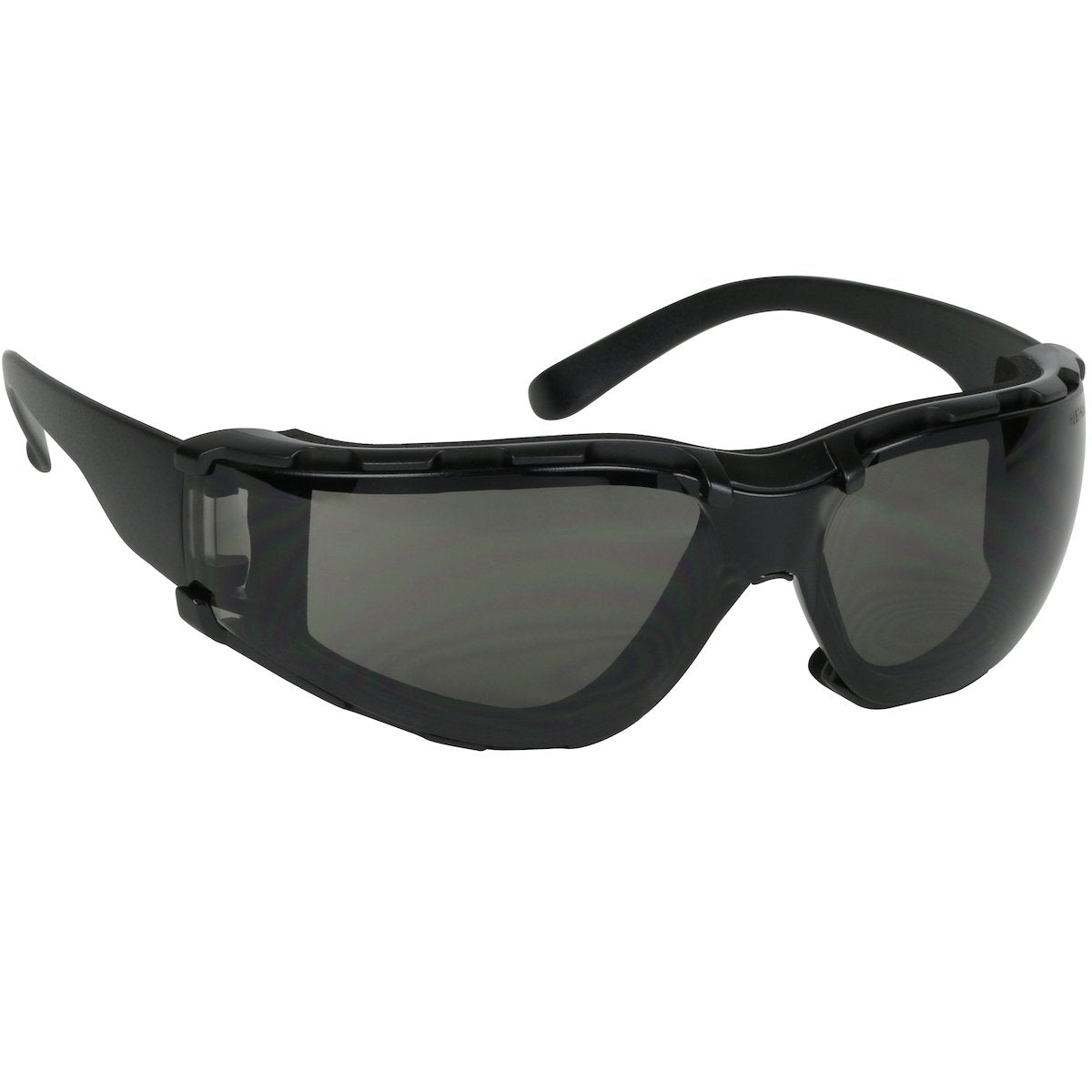 The PIP Bouton Zenon Z11SM Foam Safety Glasses feature a sleek black frame with tinted lenses in a wraparound design. The frame is equipped with side ventilation slits for added protection and comfort, all enhanced by an anti-scratch coating. These safety glasses meet ANSI Z87.1+ standards, ensuring reliable durability. Pack includes 12 pairs per box from the trusted brand PIP - Protective Industrial Products.