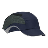 The JSP HardCap Aerolite Baseball Bump Cap by PIP showcases a dark blue design with gray mesh panels on the sides and an adjustable back. This short-brim cap, part of the 282-AES150 series, offers a sleek design with a gray trim along the brim, making it ideal for outdoor activities.