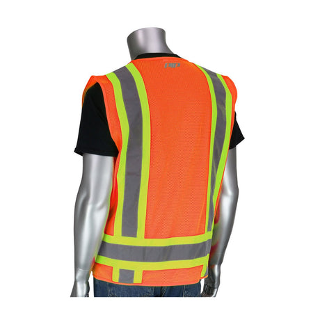 A mannequin showcases hi-visibility apparel, featuring the PIP ANSI Class 2 Two-Tone Six-Pocket Surveyor's Vest by Protective Industrial Products, which comes in a striking orange with yellow and gray reflective stripes. The vest is stylishly layered over a black shirt and blue jeans, set against a plain white background for that professional surveyor's look.