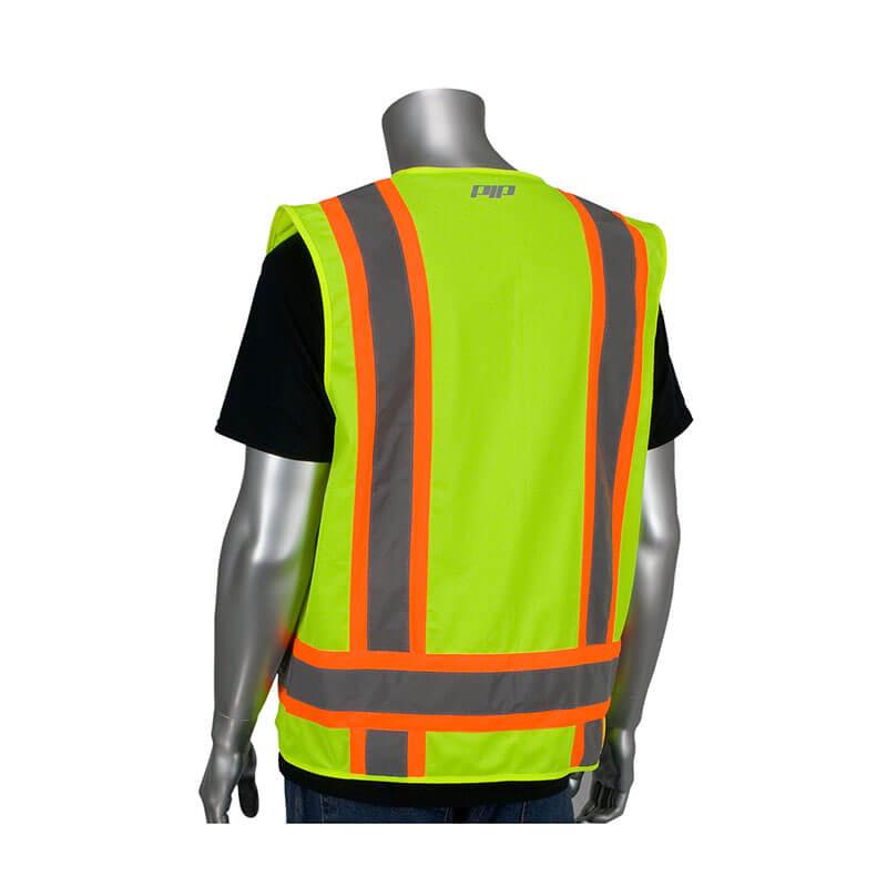 A mannequin displays the PIP Two-Tone Solid Surveyors Vest in orange, an essential piece for construction safety. This high-visibility apparel from PIP - Protective Industrial Products features fluorescent yellow fabric accented with orange stripes and reflective gray strips, layered over a black T-shirt. Positioned with its back to the camera, it emphasizes crucial workplace gear.