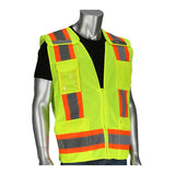 The PIP Two-Tone Breakaway Surveyors Vest by PIP - Protective Industrial Products is displayed on a mannequin, featuring vibrant yellow fabric with grey and orange reflective tape. It includes multiple pockets and a front zipper. The high-visibility vest is layered over a black shirt, highlighting its striking design.